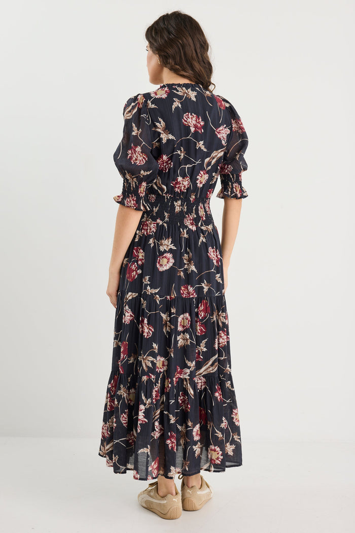 Woman wearing a floral dress on a white background