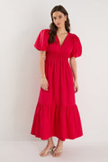 model wearing red puff sleeve dress