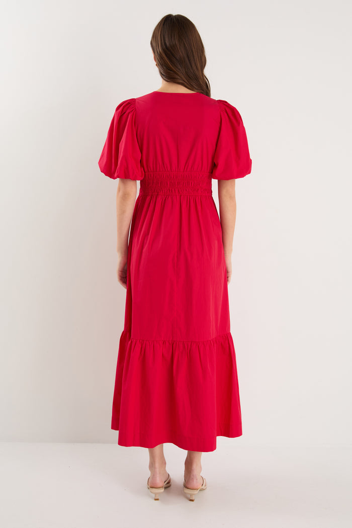 model wearing red puff sleeve dress