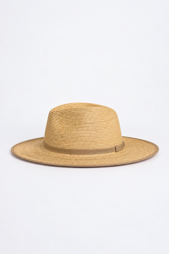 A natural straw fedora hat with a wide brim and a thin brown band around the crown, photographed against a clean white background.