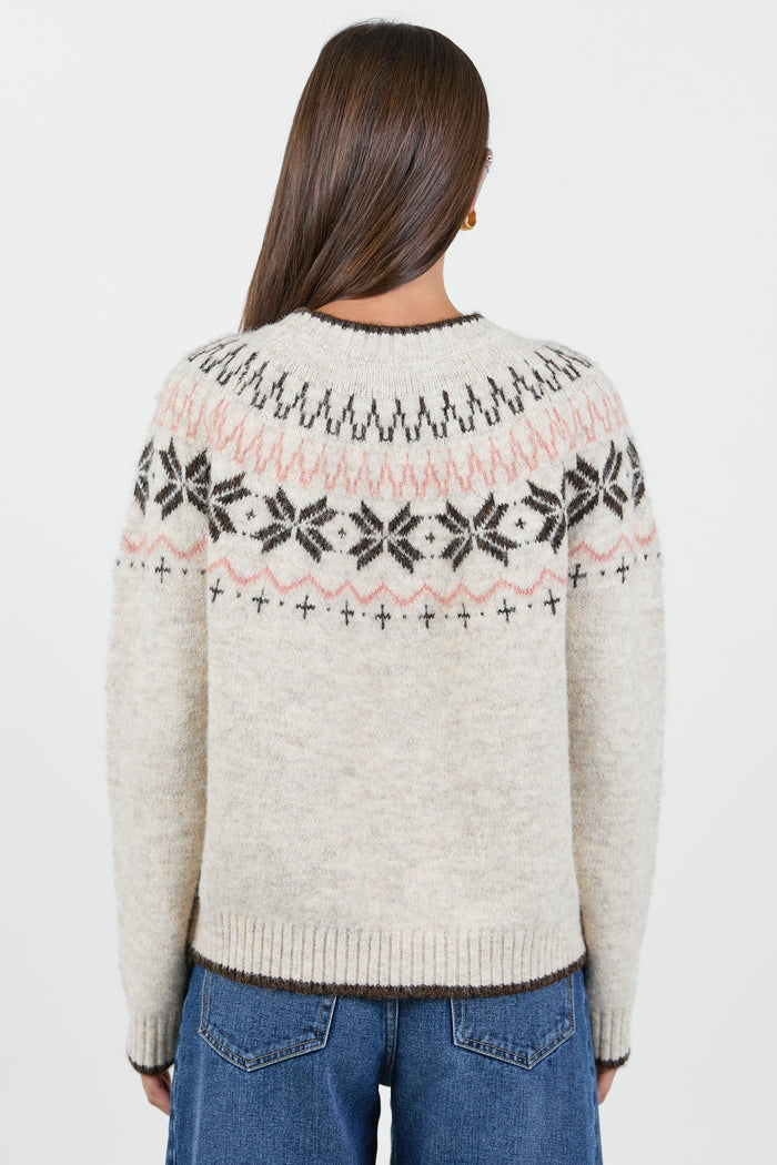 Woman wearing a cream knit