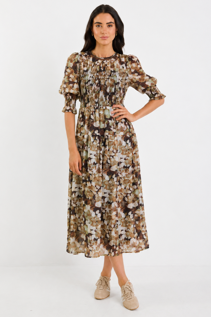 Woman wearing a floral dress on a white background