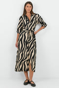 Woman wearing a zebra print dress on a white background
