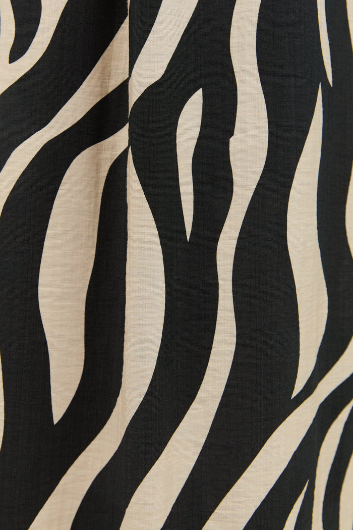 Close-up of fabric with black and beige zebra pattern