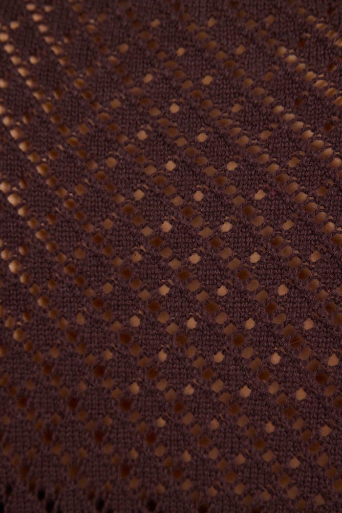 Close-up of brown fabric with a subtle pattern