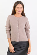 Woman wearing a beige cardigan on a white background