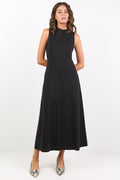 Woman wearing a black sleeveless dress on a white background