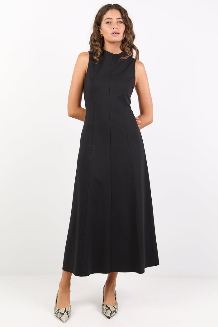 Woman wearing a black sleeveless dress on a white background