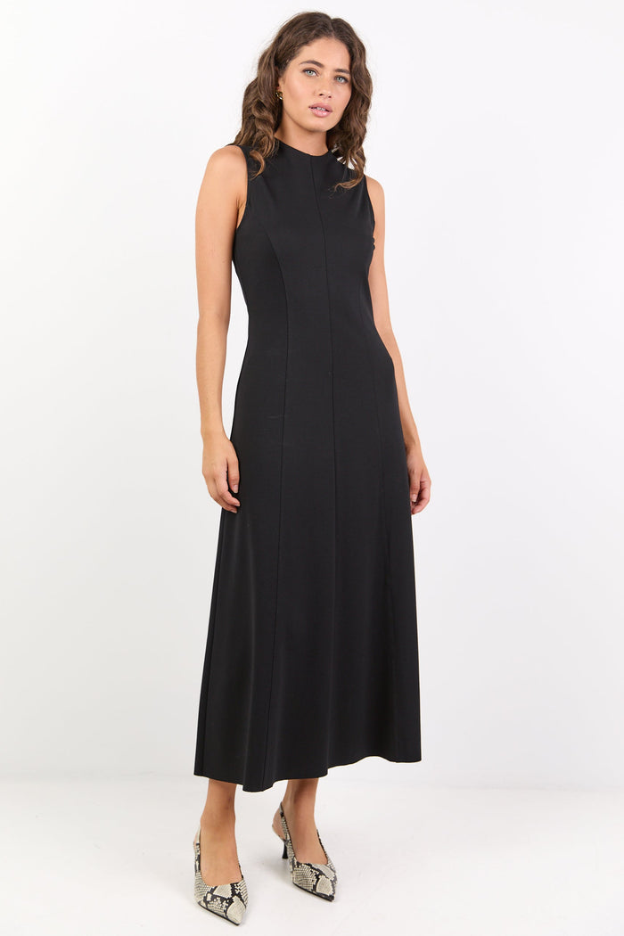 Woman wearing a black sleeveless dress on a white background