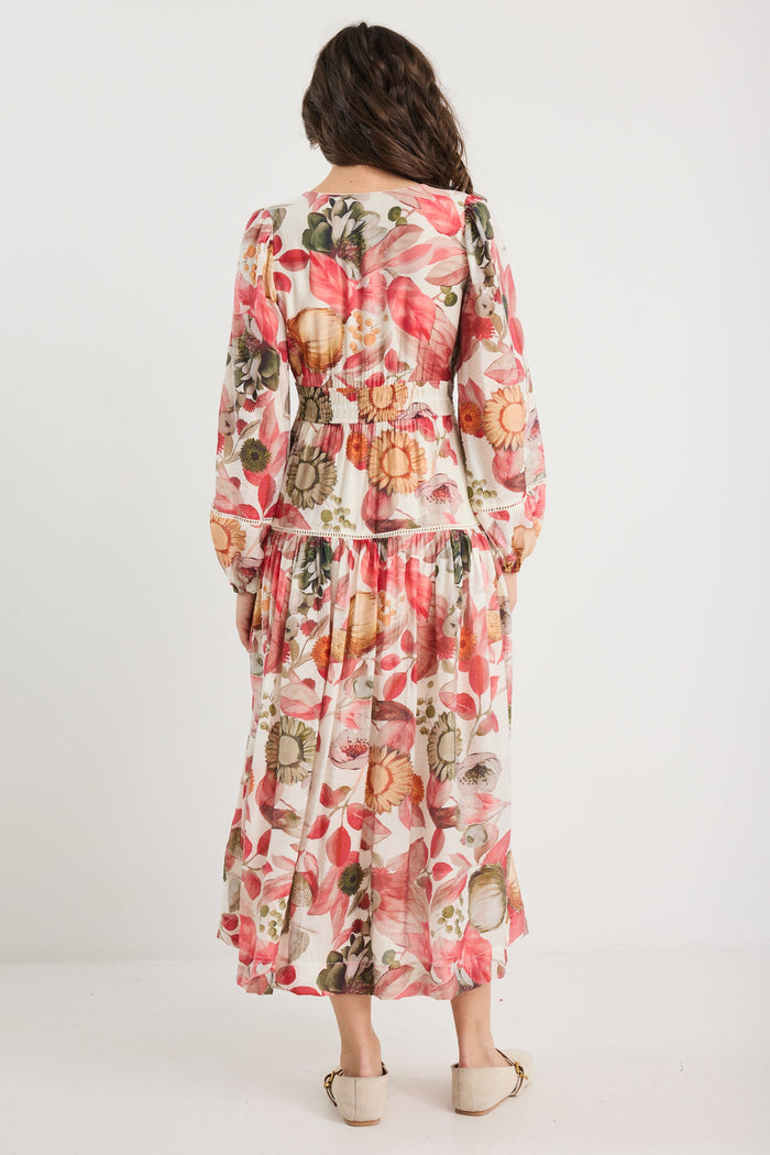 Woman wearing a floral dress on a white background