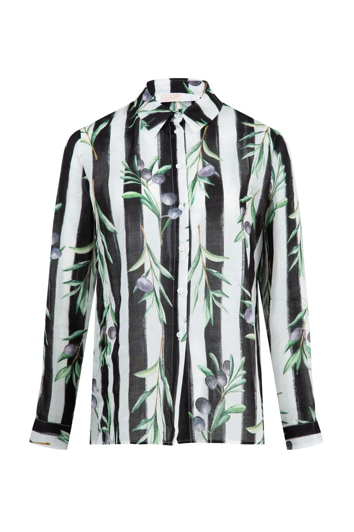 woman wearing a black white striped shirt with olive branches