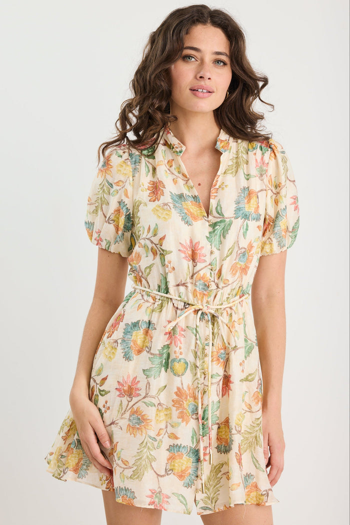 Woman wearing a floral dress on a white background