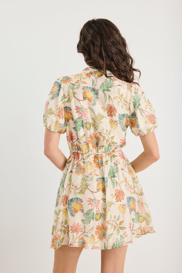 Woman wearing a floral dress on a white background