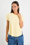 Woman wearing a yellow tee and blue jeans