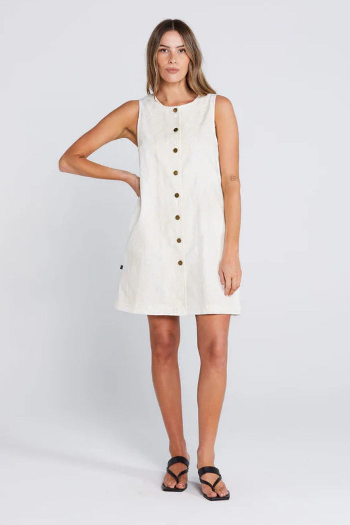 Woman wearing a light floral button down mini dress