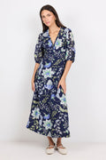 Woman wearing a floral dress on a white background