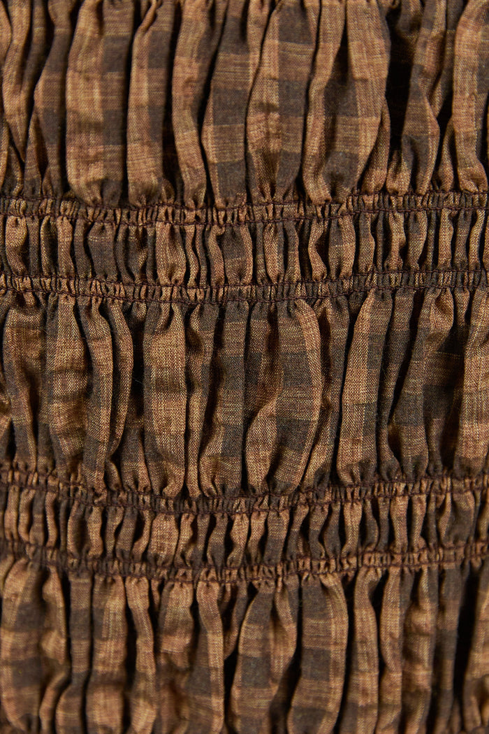 Close-up of brown fabric with a textured pattern