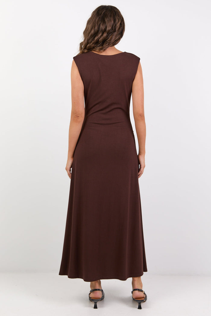 Woman wearing a brown dress on a white background