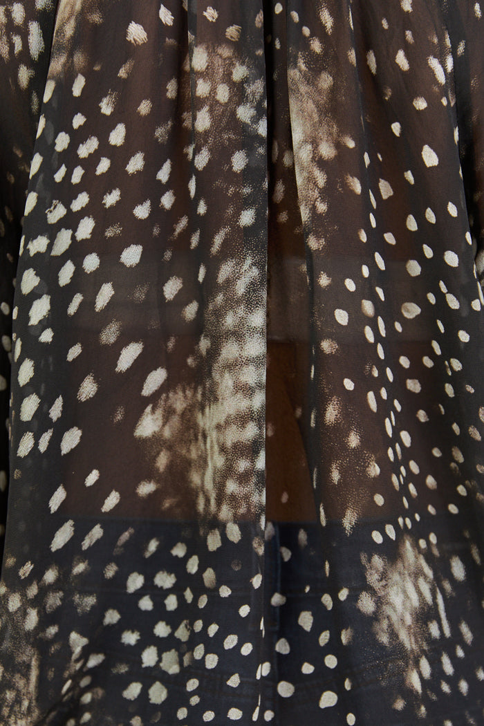 Close up of sheer patterned top.