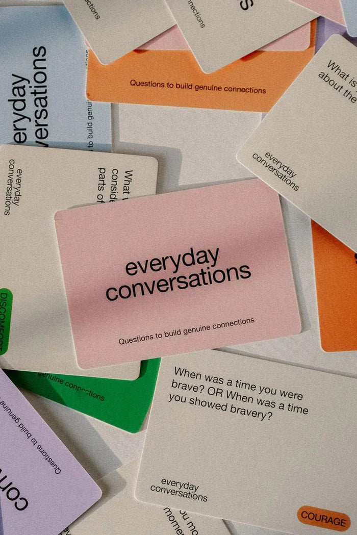 Card game titled 'Everyday Conversations' with various cards spread out.