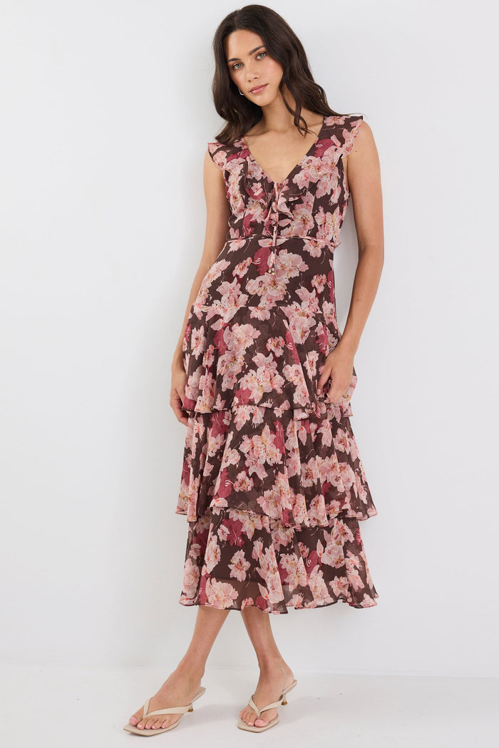 Woman wearing a floral dress on a white background