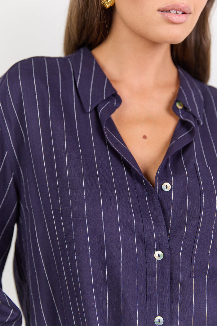 Navy pinstripe shirt worn by a model on a white background
