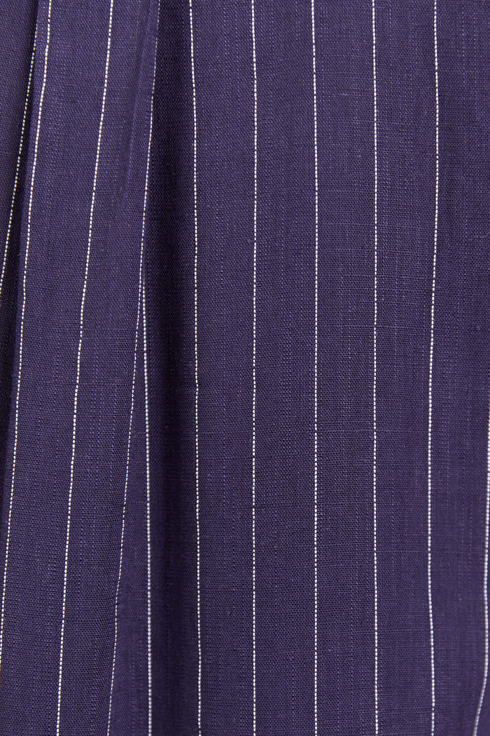 Close up of navy shirt with white stripes fabric texture.