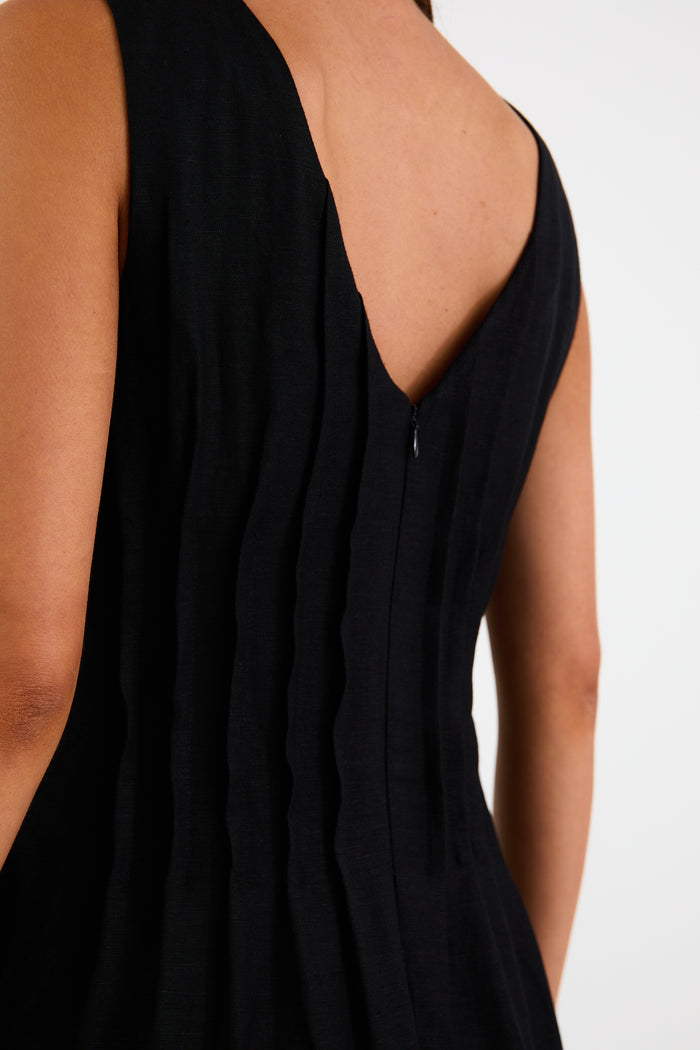 Woman wearing a black linen dress