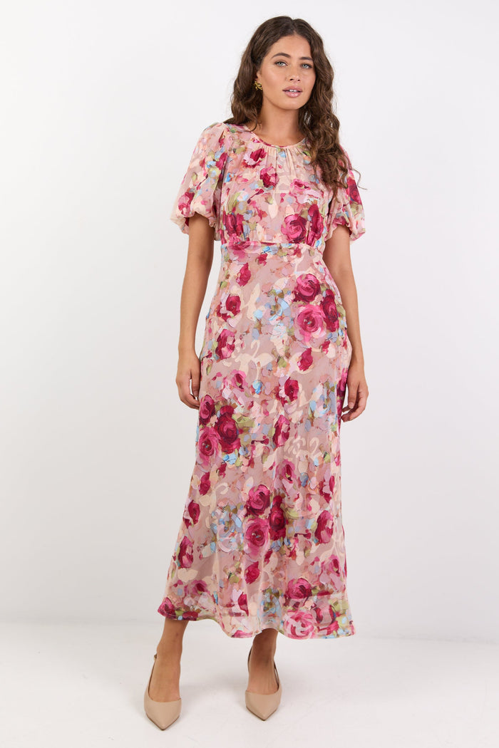 Woman wearing a floral dress on a white background