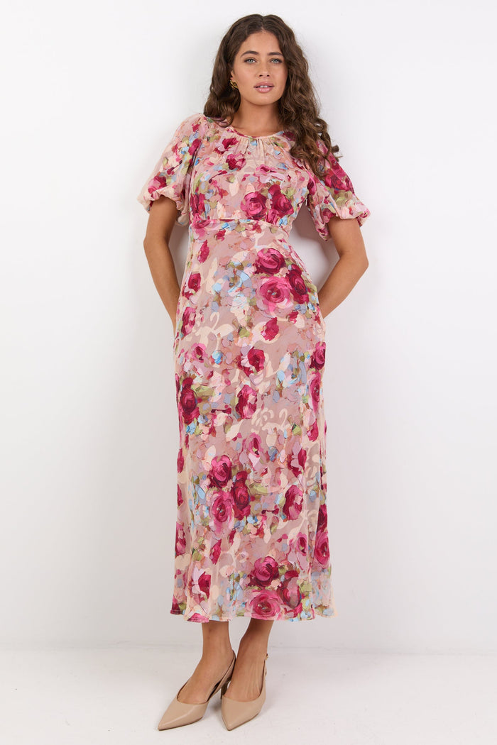 Woman wearing a floral dress on a white background
