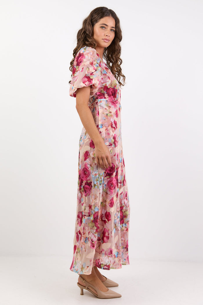 Woman wearing a floral dress on a white background