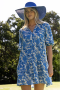 Woman wears a blue white mini smock dress