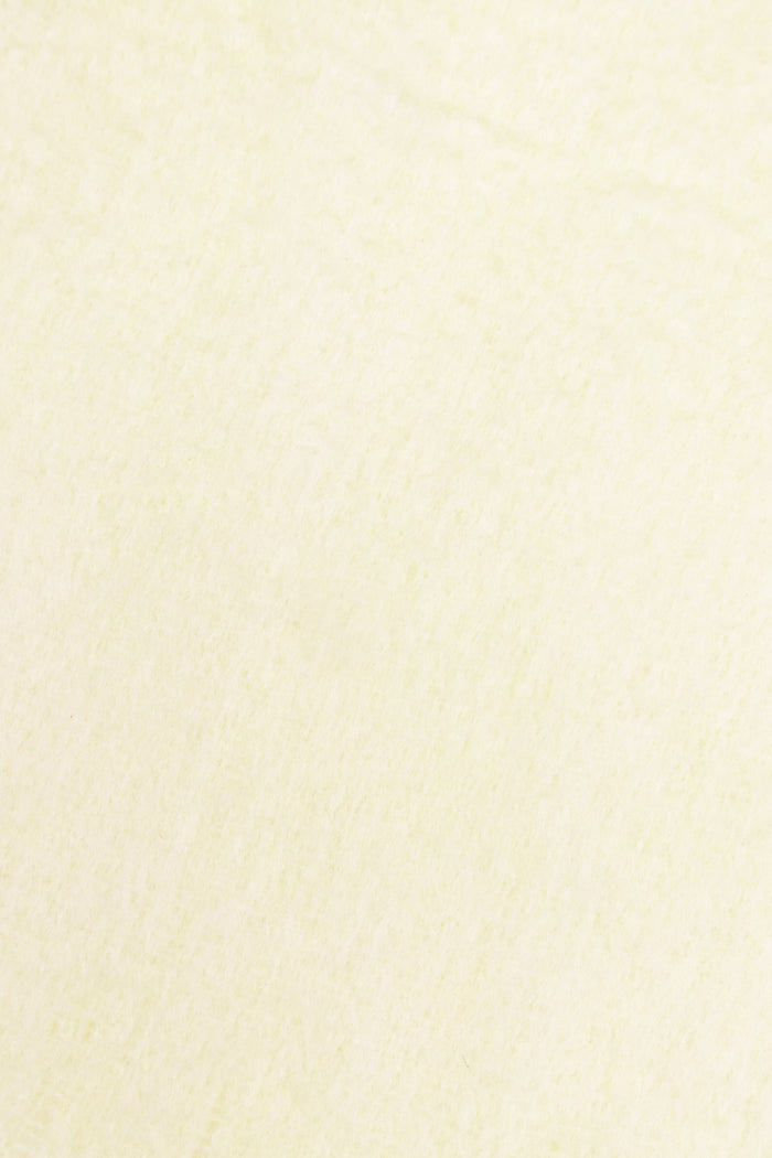 Lemon yellow coloured scarf texture close up.