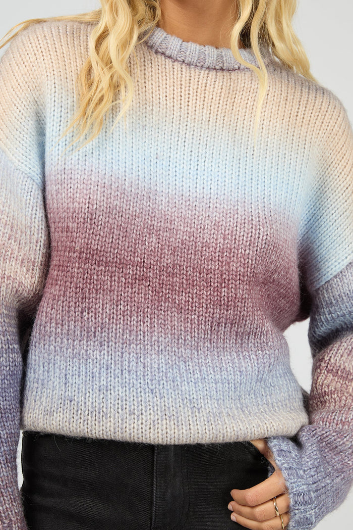 Gradient sweater worn by a person with a neutral background