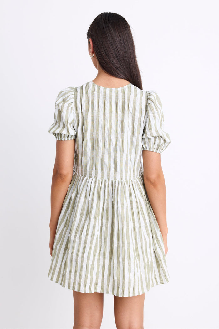 Model wearing a khaki striped puff sleeve mini dress with a V-neckline, puff sleeves, and a tie detail at the front.