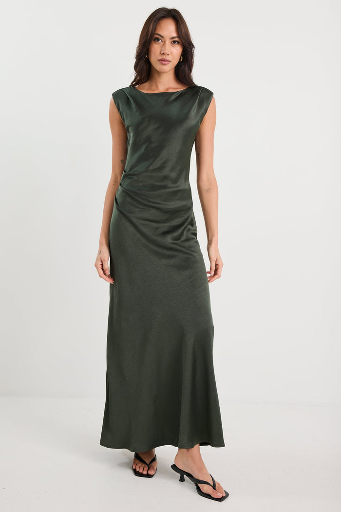 Woman wearing a green dress on a white background