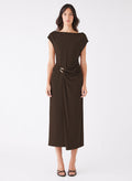 model wears a long brown dress