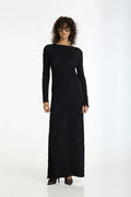 Woman wearing a black long-sleeve dress on a white background