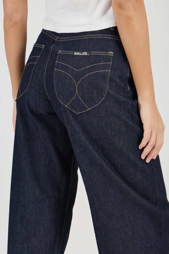 Dark blue jeans with a brand logo on a white background