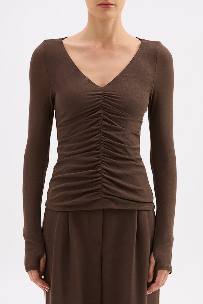 Brown long-sleeve top and wide-leg pants on a white background