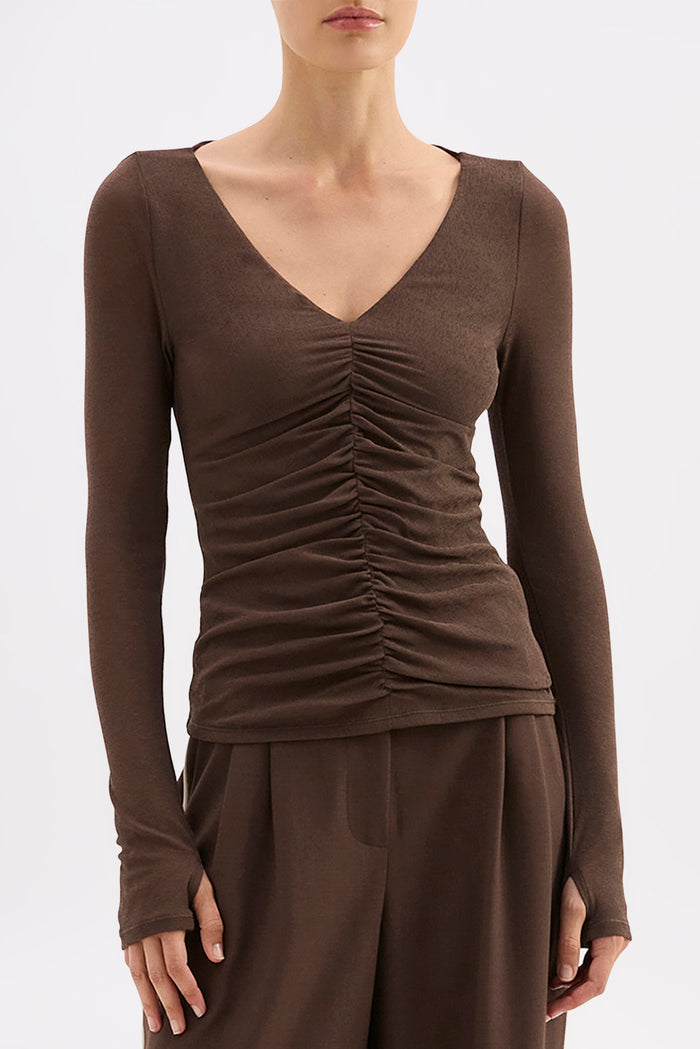 Brown long-sleeve top and pants on a white background