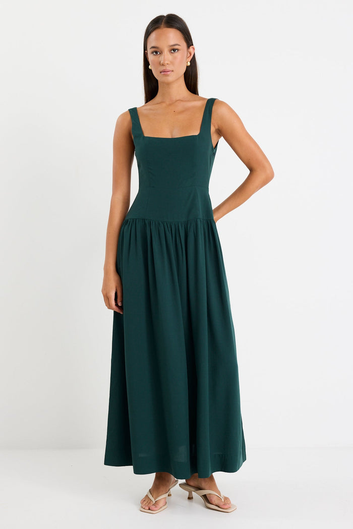 Woman wearing a green dress on a white background