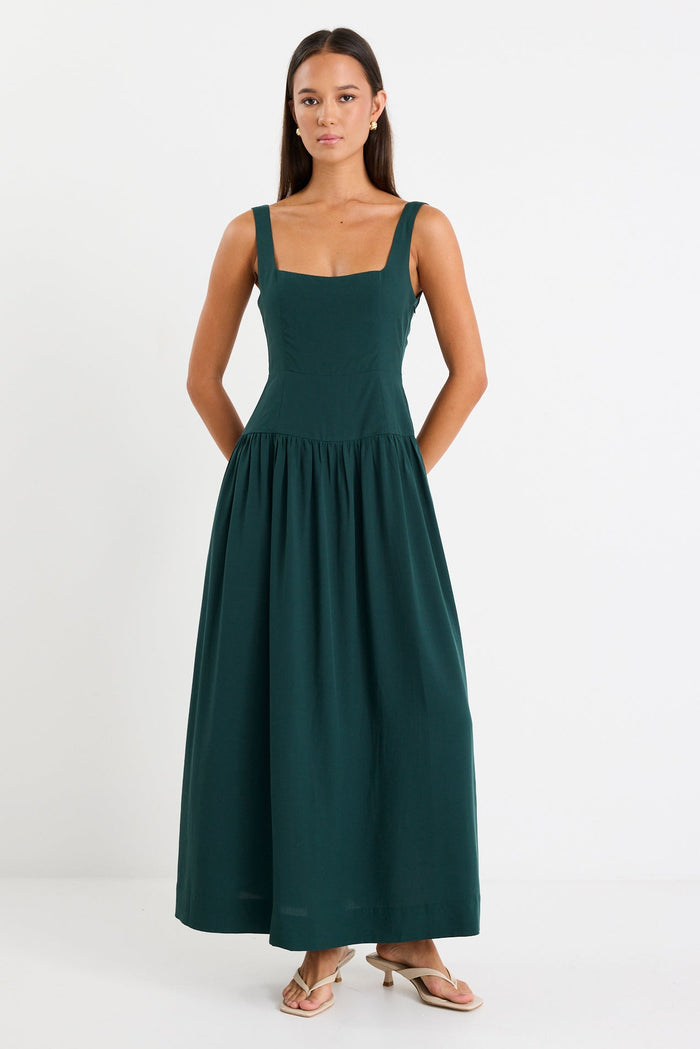Woman wearing a green dress on a white background