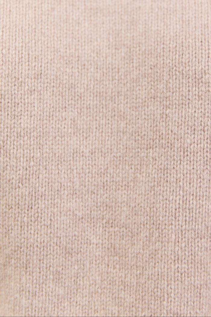 Close-up of a textured beige fabric surface