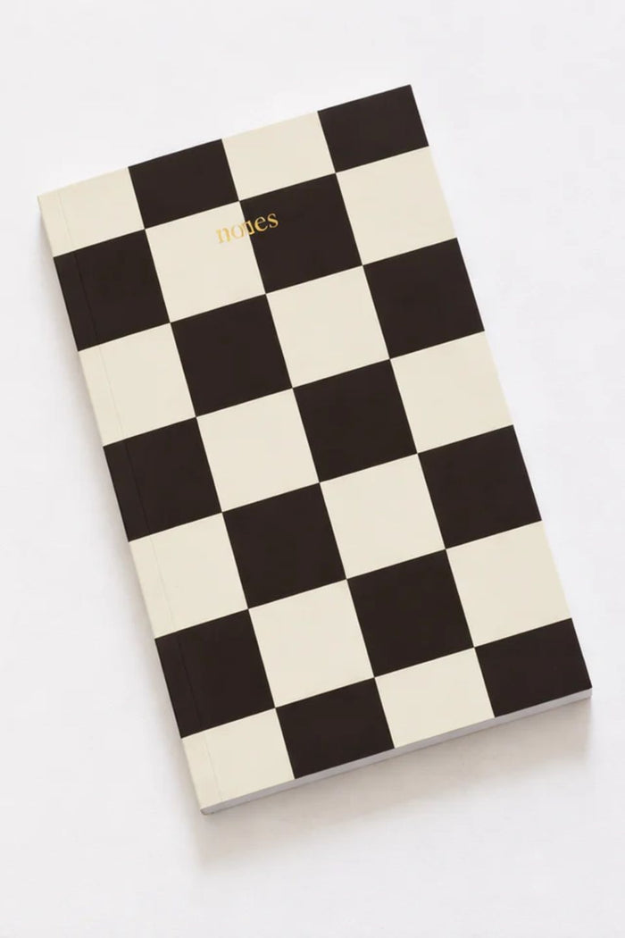 Checkered notebook with 'Diaries' text on a white background