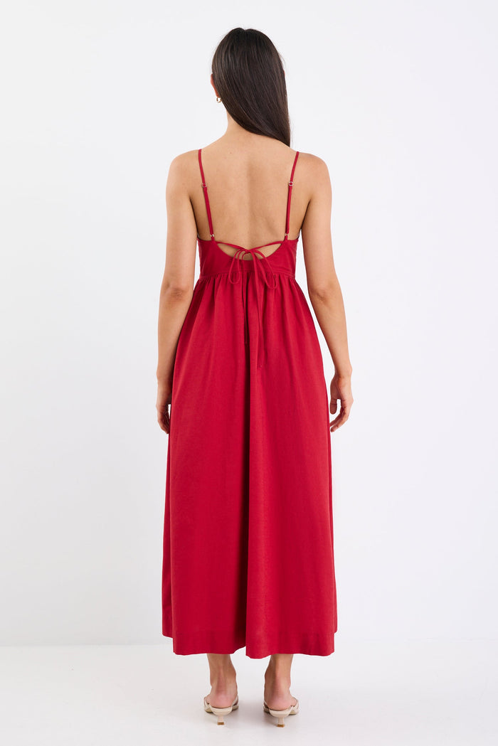 Red dress with thin straps on a white background