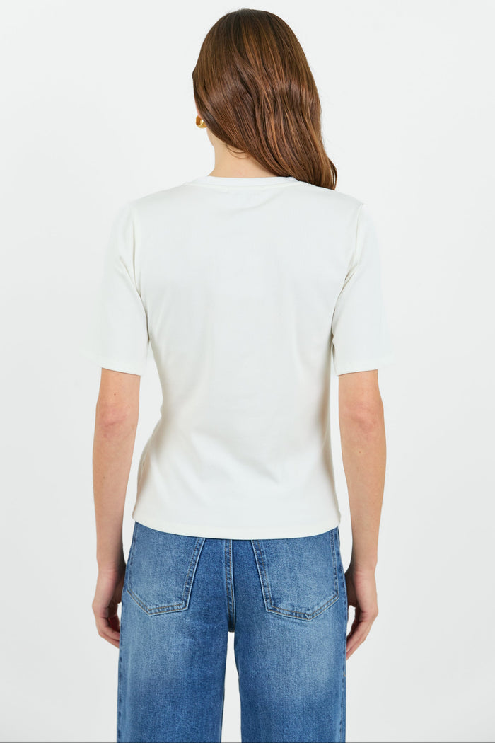 Back view of a Woman wearing a white t-shirt and blue jeans on a white background