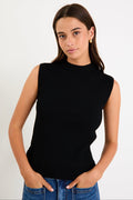 Woman wearing a black sleeveless ribbed top against a white background