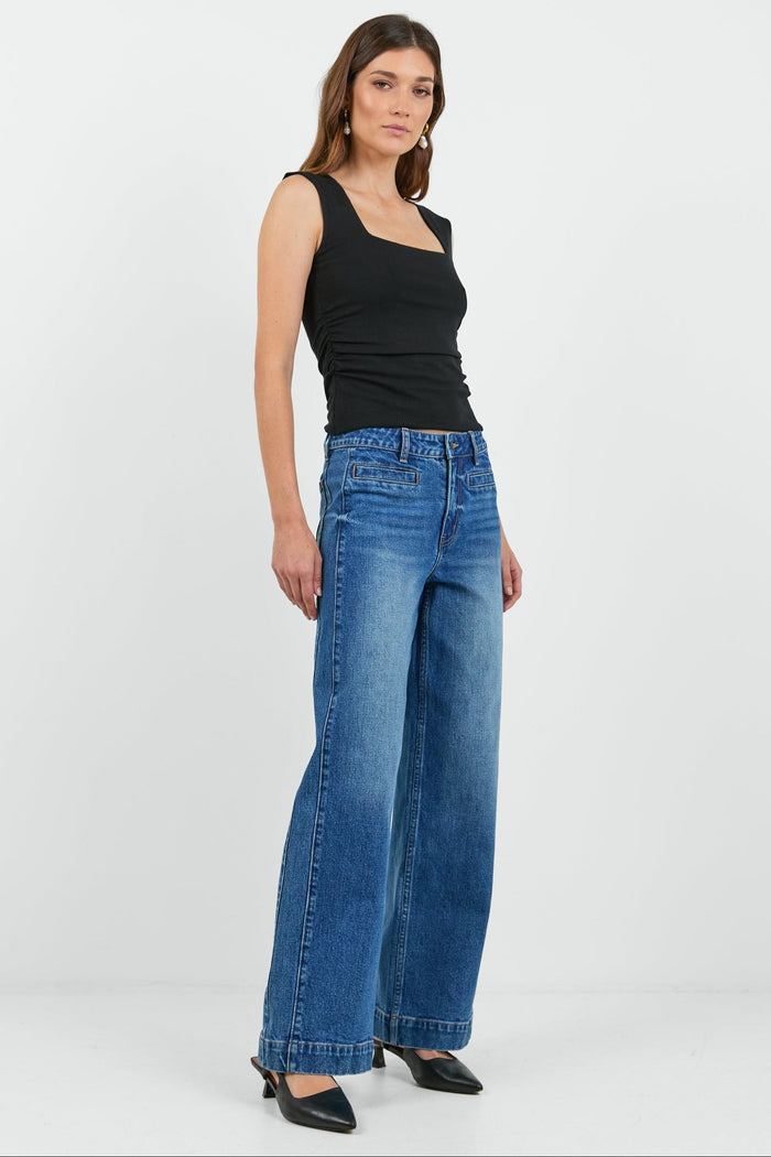 Women wearing wash blue jean and black tank