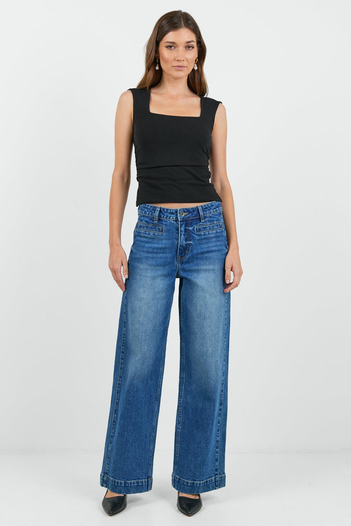 Women wearing wash blue jean and black tank